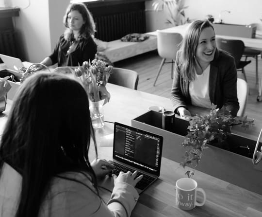 People sitting at a table while working