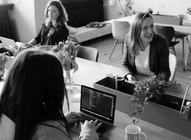 People sitting at a table while working